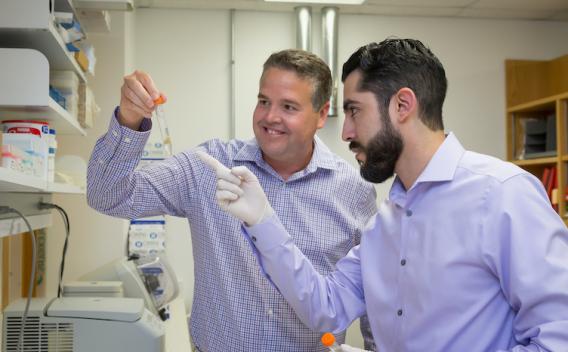 Two lab members in lab