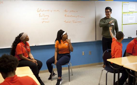 YAM trainer teaching in a classroom