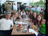 Lab members at a table having drinks in the sunlight at the Meddlesome Moth
