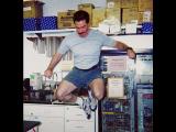 Lab member jumping into the air in the lab