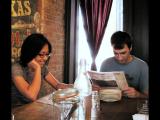 Lab members at a restaurant looking over the menu