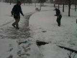 Two lab team members playing in the snow