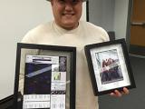 Sungyul Lee Thesis Defense - holding framed photos