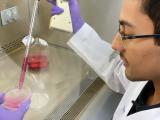 Jugal Mohapatra drawing liquid into a tube