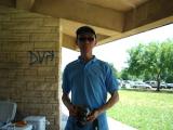 One team member in pavilion at park
