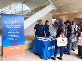 attendees at a booth