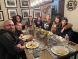 Dinner with the Beckham lab, members around a dinner table with empty plates and glasses