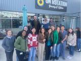 The lab team poses in front of a  building, On Rotation Brewery & Kitchen.