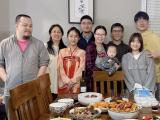MUDIA lab team and families at a group dinner.