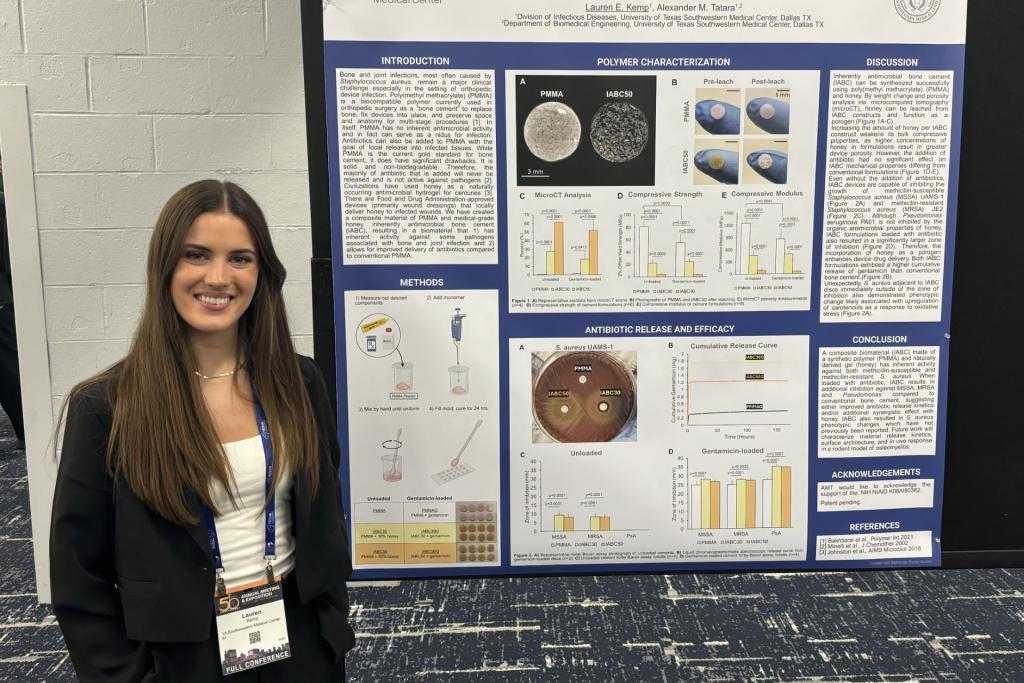 Lauren Kemp in front of research poster