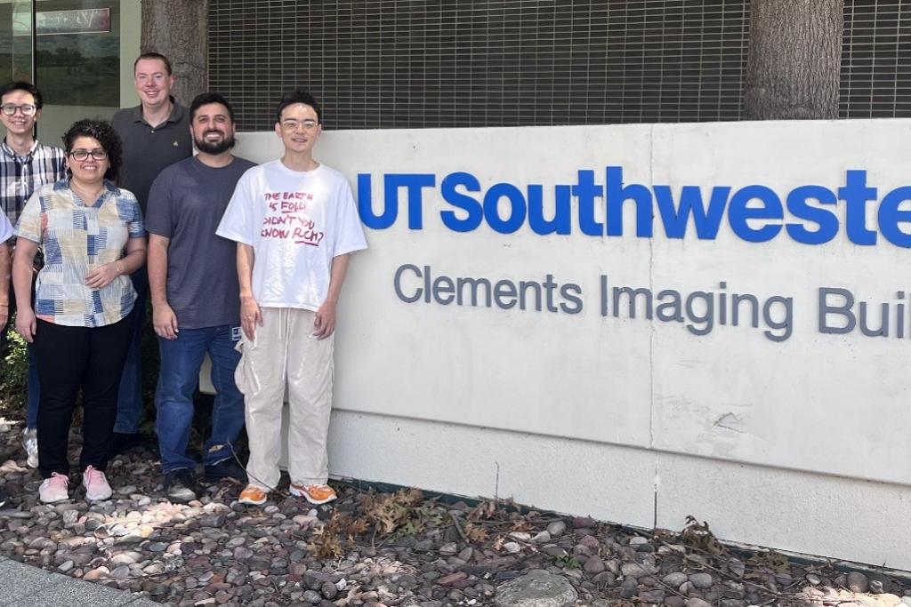 Gloeggler lab team of 6 diverse researchers outside UT Southwestern Clements Imaging Building