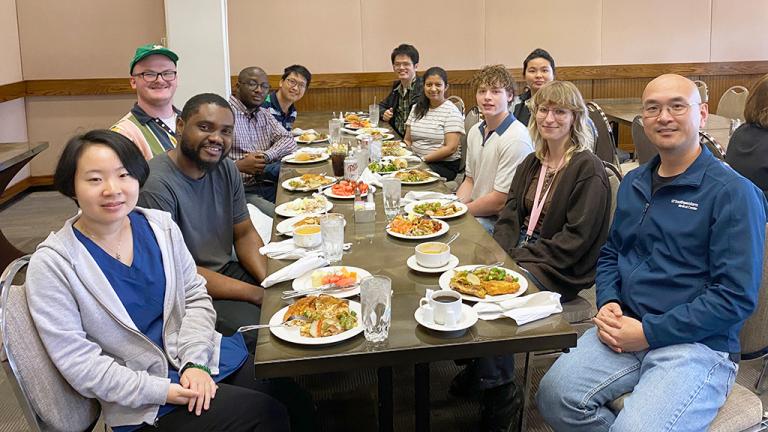 Stone Chen Lab members sitting at resturant table