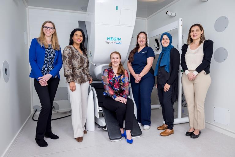 MEG team with the MEG scanner