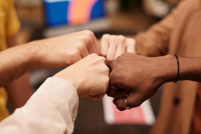 Multi-hand fist bump
