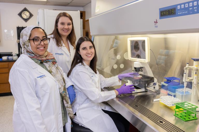 Lab Members at Biosafety Hood