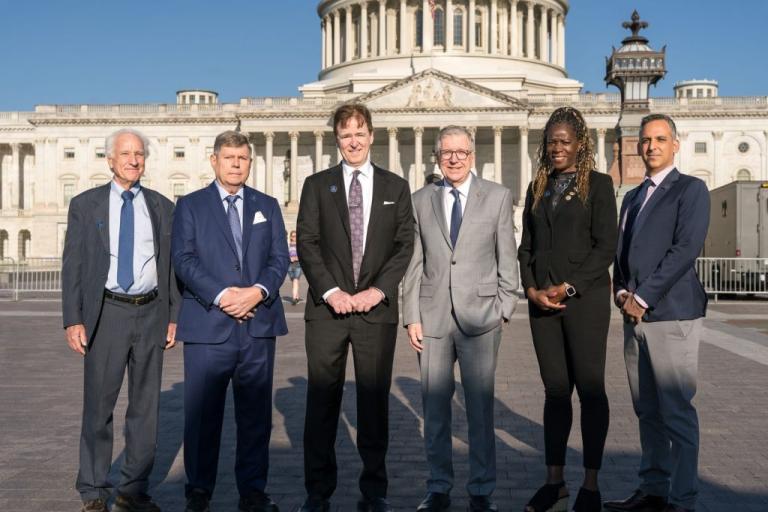 Dr. Martin Pomper and colleagues standing outside the U.S. Capitol during the American Innovator Award recognition event.
