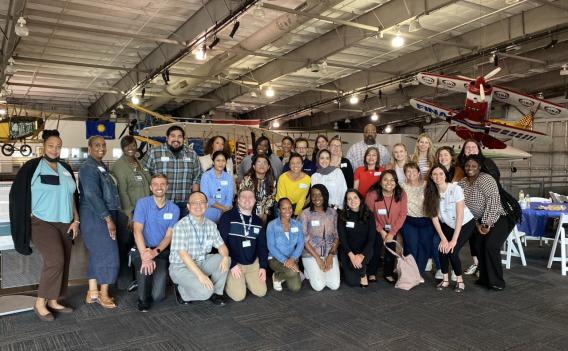 large group of people posing for picture
