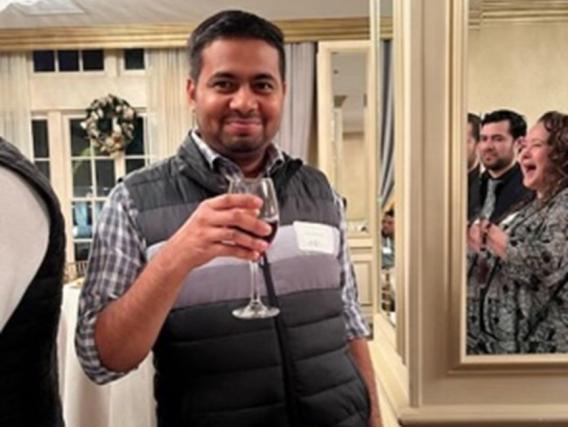 Pravat poses for camera in a home setting