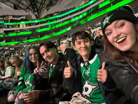 lab members at Dallas Stars Hockey Game