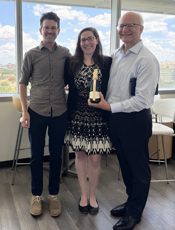 Dr. Sam Pappas and Dr. Bill Dauer celebrate with Caitlin Leedy after her successful dissertation defense.