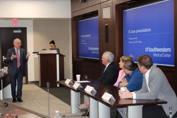 Dr. Zimmern talking to Drs. Clemens, Carmel, Partwardhan and Kolber in front of the room during a panel discussion