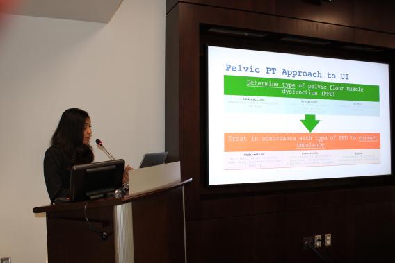 Dr. Rupali Kumar during her presentation at a podium