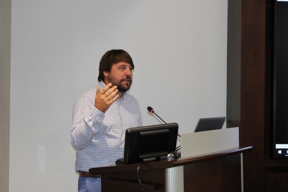 Dr. Taylor Ware during his presentation at a podium