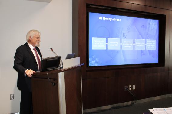 Dr. Brian Rolston during his presentation at the podium