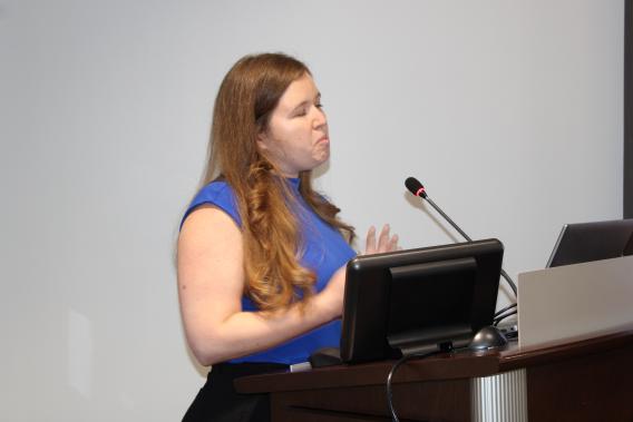 Dr. Nicole De Nisco during her presentation at the podium