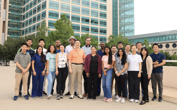 Gao Lab team gathered in front of Texas de Brazil