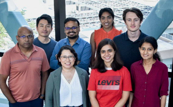 Eight people from the Malladi lab pose for the camera