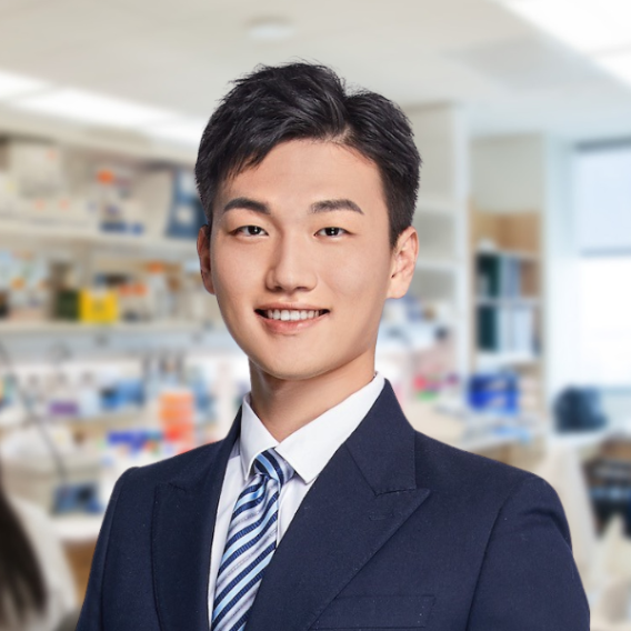 Visiting student Changlin Gong, a young man in a dark colored suit and tie