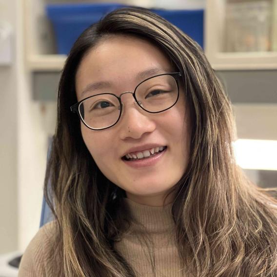 Dan Tong lab member, Zhijing Wu standing in the lab