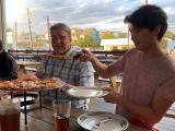 Two people eating pizza for dinner