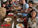 The lab group eating pizza