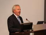 Dr. Quentin Clemens at a podium
