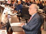 Dr. Philippe Zimmern at a table in the audience with his computer