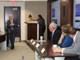 Dr. Zimmern talking to Drs. Clemens, Carmel, Partwardhan and Kolber in front of the room during a panel discussion