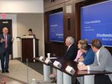 Dr. Zimmern talking to Drs. Clemens, Carmel, Partwardhan and Kolber in front of the room during a panel discussion