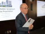 Dr. Zimmern in front of the room speaking to the audience