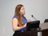 Dr. Nicole De Nisco during her presentation at the podium