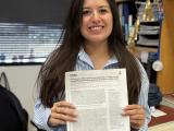 Daniela Barbosa holding manuscript