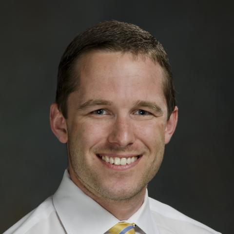 Dr. Rios, smiling man with short dark hair.